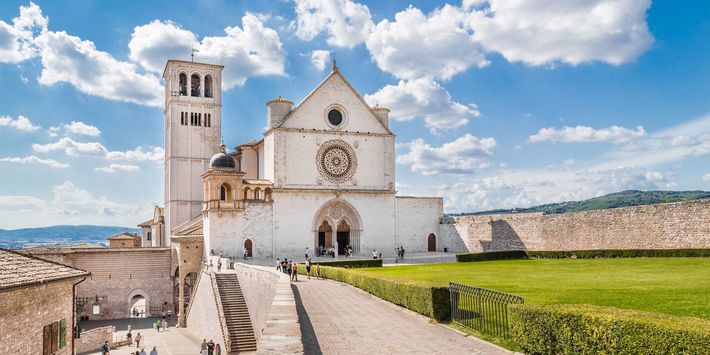 Basilica of St. Francis of Assisi on a sunny day in Assisi, Umbria, Italy